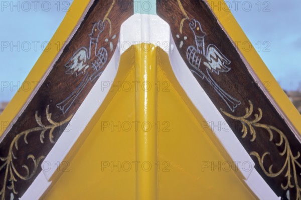 Part of bow of fishing boat with typical colourful painting for Maltese fishing boats, Valletta, Malta