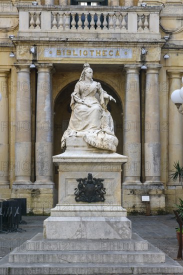 Marble statue of Queen Victoria of Great Britain in front of entrance to National Library of Malta building, Valletta, Malta