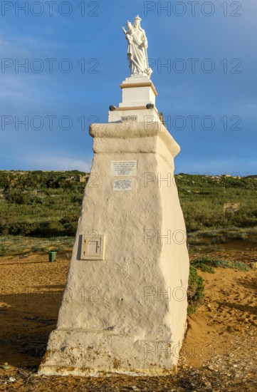 Statue of Madonna Maria Mother of God on Ramla Bay beach, Gozo Island, Malta