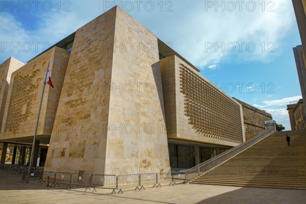 Parliament building by Renzo Piano with sandstone façade in Maltese capital of Malta Valletta, next to one of two wide staircases on Bastion, Valletta, Malta