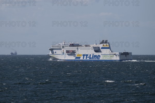 LNG-powered TT-Line ferry travelling across a gently moving blue sea, near Warnemünde, Rostock, Mecklenburg-Vorpommern, Germany