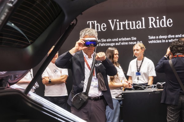 Mercedes trade fair stand with virtual presentation. Trade fair visitors with 3D glasses. The Virtual Ride. CLA Shooting Brake. IAA MOBILITY in Munich. The motor show presents itself as a holistic mobility trade fair. But cars are still the centre of attention. Munich, Bavaria, Germany