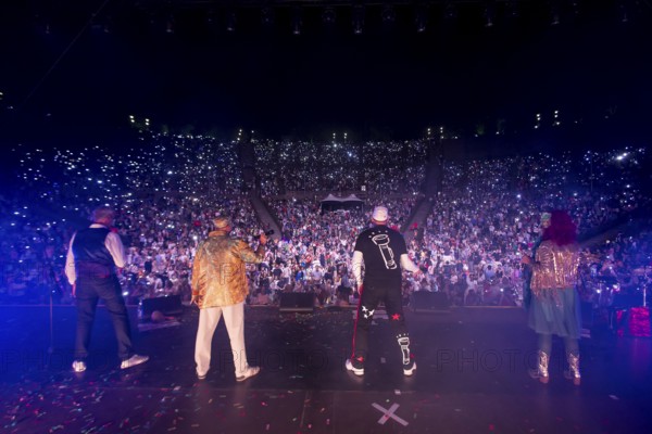 Jörn Brumme (boss / voc, fl, git), Peter Schenderlein (director / voc, piano, keyb), Max von Thien (leader / voc, drum, perc) and Blanche Elliz (boss, vic, acc, perc) at the 25th Berlin Flashlight Concert at the Berlin Waldbühne on 20.09.2025
