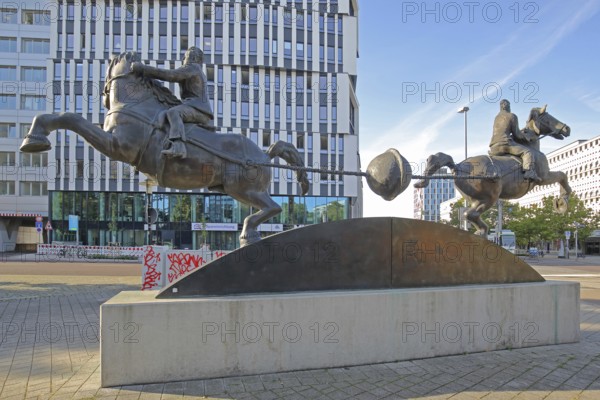 Magdeburg hemispheres by Thomas Virnich 2012, monument to physicist and mathematician Otto von Guericke, two equestrian figures pull apart halved sphere, inventor, negative pressure, vacuum, symbol, power, strength, separate, struts, inside, landmark, Ratswappenplatz, Magdeburg, Saxony-Anhalt, Germany
