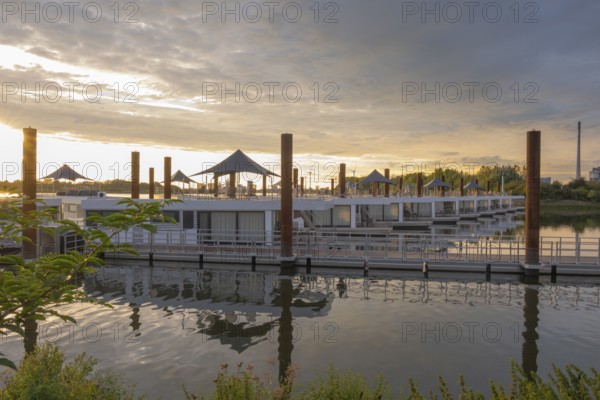 View of house messengers at Lankenauer Höft at Neustadt harbour in the evening light, Weser, Bremen, Germany