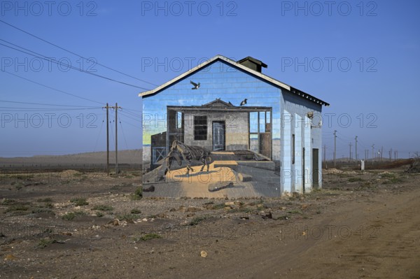 Painted house facade, graffito, brown hyena, diamonds, Oranjemund, Karas region, Namibia