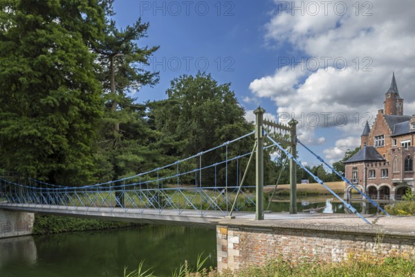 1824 iron suspension bridge in park of the Wissekerke Castle, Kasteel van Wissenkerke in the village Bazel near Kruibeke, East Flanders, Belgium