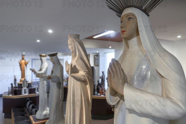 Religious statuettes in museum near Our Lady of Beauraing, Notre-Dame de Beauraing sanctuary, place of pilgrimage at Beauraing, Namur, Belgium
