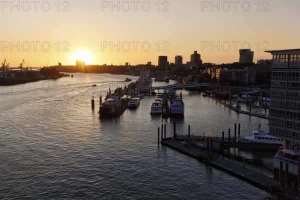 Hamburg harbour, view from the Elbphilharmonie over the Elbe at sunset, jetty, cranes of the container port on the horizon, Hamburg, Germany