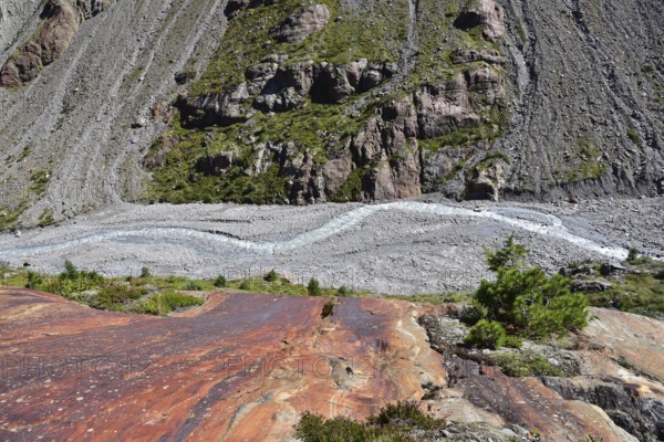 Hiking area below the Gepatsch Glacier in the Kaunertal with red rocks and the Faggenbach stream, Ötztal Alps, Tyrol, Austria