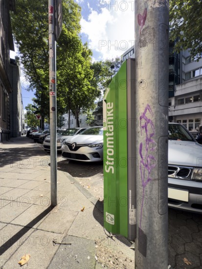 Lamp charging column of Stadtwerke Düsseldorf in the city centre of Düsseldorf, Germany, digitally reworked