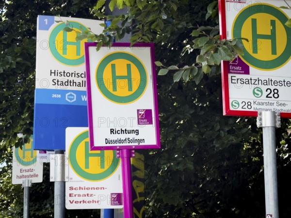Many signs indicating rail replacement services due to construction work on Deutsche Bahn railway lines in Wuppertal, Germany