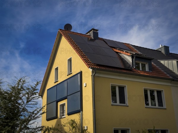 Solar panels on the roof and façade of an apartment block in Wuppertal, Germany