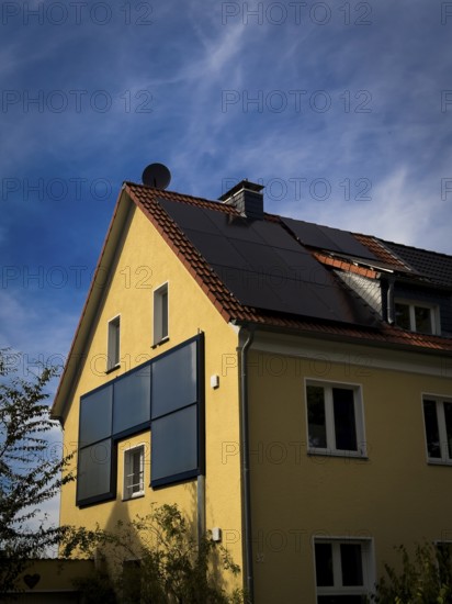 Solar panels on the roof and façade of an apartment block in Wuppertal, Germany