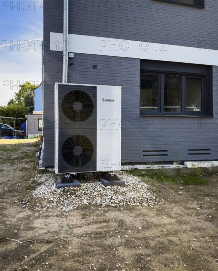 An air heat pump in the front garden of a renovated detached house in Düsseldorf, Germany