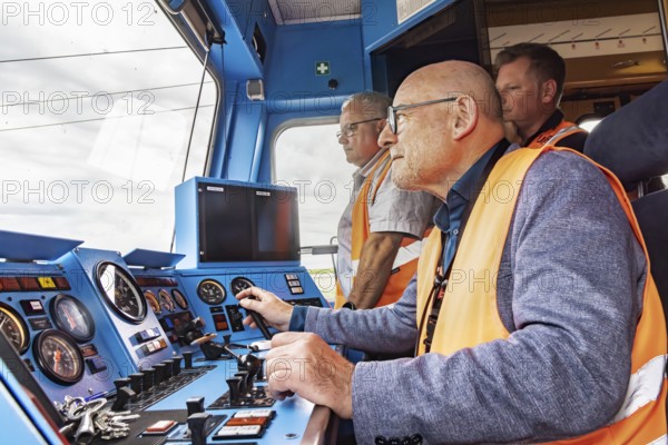 A minister as train driver: Winfried Hermann (MdL, Bündnis 90-Die Grünen, Minister of Transport BW) in the driver's cab of a railcar. Test run on the new line between Wendlingen and the new airport railway station. The section of the Stuttgart-Ulm high-speed line is due to come online at the end of 2026. It is a central component of the Stuttgart 21 railway project. Stuttgart, Baden-Württemberg, Germany