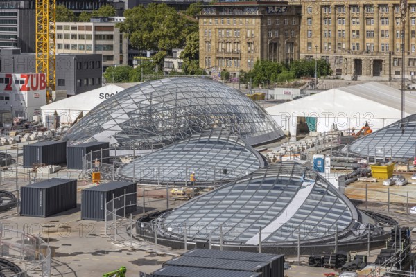 Stuttgart 21 construction site at the main station. View of the glass eyes of the future underground through station. 27 light eyes will illuminate the new underground through station. Façade construction specialist Seele is currently installing the glass, steel and aluminium construction in a complex process. The light eyes have a diameter of up to 21 metres. Stuttgart, Baden-Württemberg, Germany