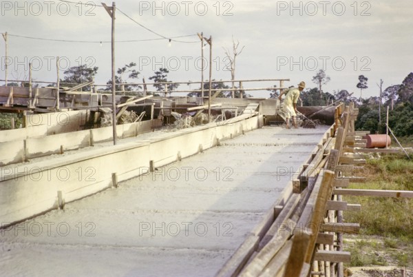 Open Cast gravel-pumping tin mine Malaya, Malaysia, south east Asia 1964 - Ore separation in the Palong, the palong acts as a processing sluice with riffles or bars