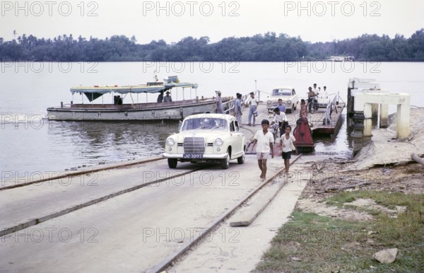 Car ferry river crossing East coast, Malaya, Malaysia, south east Asia 1964 - view looking north, Mercedes-Benz 190 Ponton model car