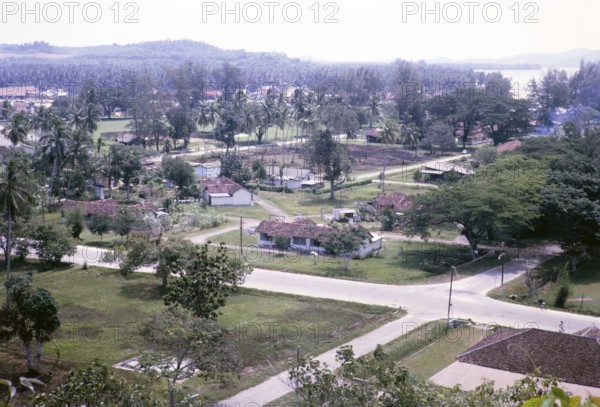View over houses in coastal area near Mersing, Johor, Malaya, Malaysia, south east Asia 1964