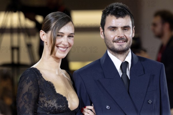 Venice, Italy - 3 September 2025: Devon Lee Carlson, Duke Nicholson during the Red Carpet of - Cartier Glory To The Filmmaker Award 2025 and In the Hand of Dante - during the 82nd Venice International Film Festival