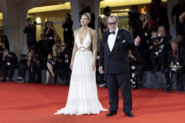 Venice, Italy - 3 September 2025: Louise Kugelberg and Julian Schnabel during the Red Carpet of - Cartier Glory To The Filmmaker Award 2025 and In the Hand of Dante - during the 82nd Venice International Film Festival
