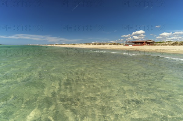 Crystal-clear turquoise water on the beach at Torre San Giovanni, Marina di Ugento, Apulia, Italy