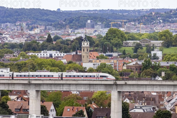 Deutsche Bahn AG ICE train travelling on the Schusterbahn, Münster viaduct with city view of Bad Cannstatt. Rosenstein Park, Rosenstein Castle. Stuttgart, Baden-Württemberg, Germany