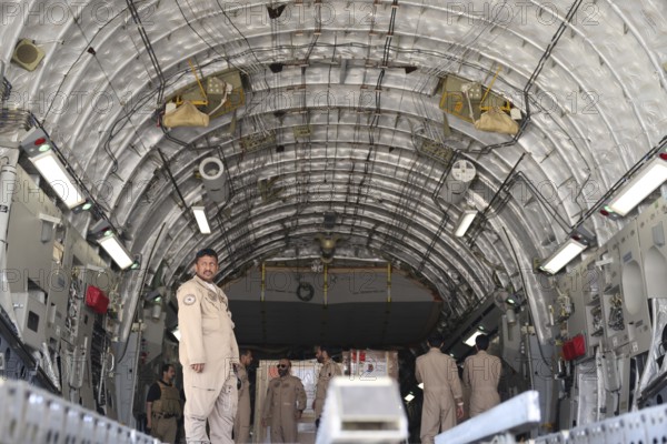 Members of the Qatari Air Force unload humanitarian aid supplies from a transport aircraft at Damascus International Airport as part of Qatar's air and land relief bridge to Syria, Damascus, Damascus, Syria