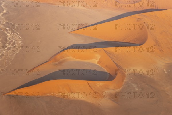 Sand dunes in the Namib Desert. In the evening. Aerial view. Namib-Naukluft Park, Namibia