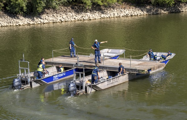 Exercise run of a multi-purpose pontoon in the Rhine harbour, of the specialist group for water hazards, in Düsseldorf, the motorised pontoon can be used as a ferry for people or equipment, as a working platform or bridge, during the major exercise FÜLEX25, of the THW, Federal Agency for Technical Relief, North Rhine-Westphalia, lasting several days, over 3500 volunteers from the 127 North Rhine-Westphalia local associations practise many different deployment scenarios over 4 weekends