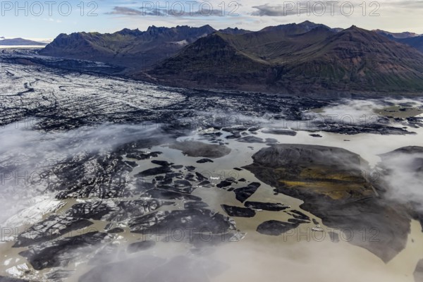 Icebergs, ice floes, glacier tongue, glacier edge, glacier, lake, glacier lagoon, aerial view, black ice, climate change, summer, mountains, Skeidararjökull, Skaftafell, Vatnajökull National Park, Iceland