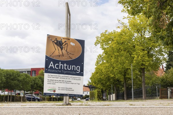 Attention Asian tiger mosquito (Aedes albopictus) . Poster with hazard warning and rules of behaviour for the population in the town of Walldorf. Walldorf Baden-Württemberg, Germany