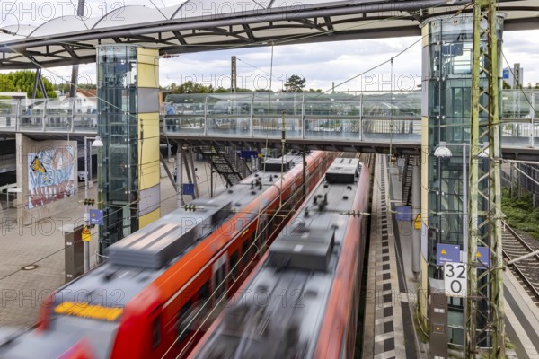Railway station with passing S-Bahn in Walldorf-Wiesloch. Wiesloch, Baden-Württemberg, Germany