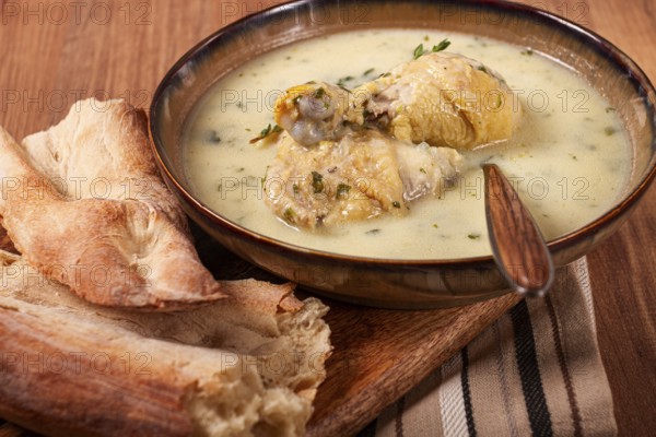 Chikhirtma chicken soup, Georgian dish, with lavash, top view, no people