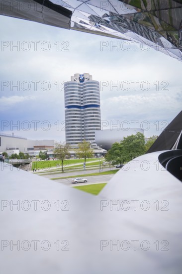 Modern building construction with characteristic design and surrounding landscape, BMW Welt, Munich, Germany