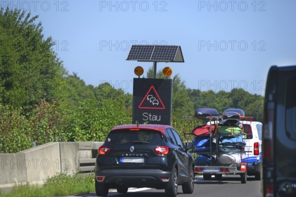 Traffic sign with solar-powered traffic jam warning on the motorway, Baden-Württemberg, Germany
