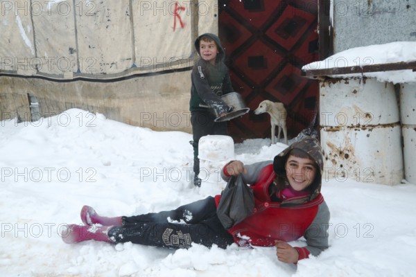 Displaced Syrian families and children living in refugee camps during harsh winter conditions, facing snow, cold weather, and difficult humanitarian circumstances. Aleppo, Syria January 01, 2022, Aleppo, Syria