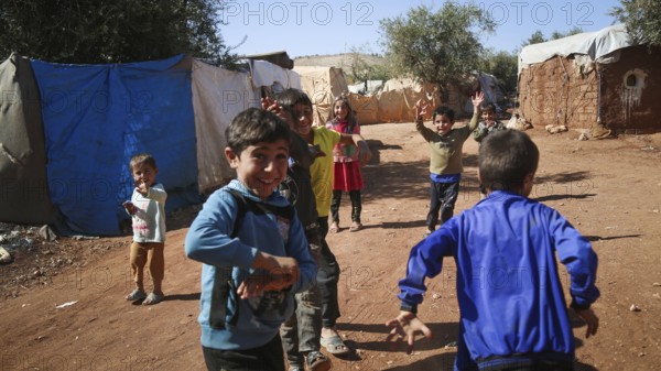 Syrian children playing in a refugee camp near the Turkish border on World Children's Day. Aleppo, Syria October 29, 2022, Aleppo, Syria
