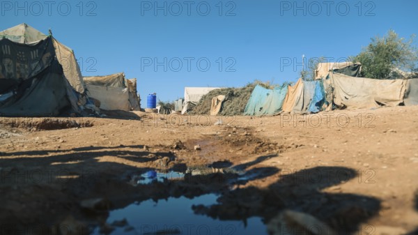 Worn-out tents housing Syrian refugees near the Turkish border, showing the dire humanitarian conditions in which displaced people are forced to live. Aleppo, Syria. January 26, 2023, Aleppo, Syria