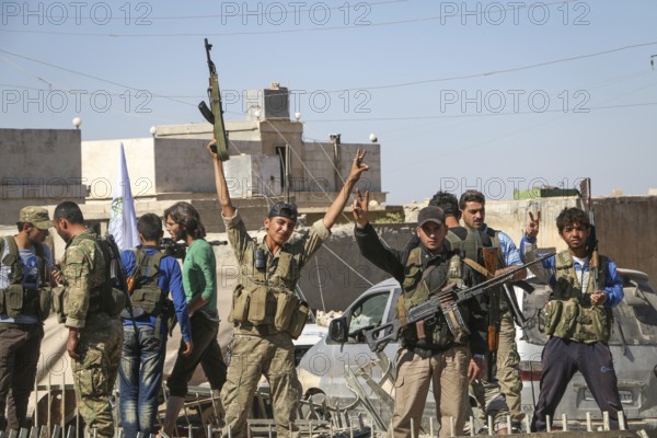 Fighters from the Free Syrian Army celebrate victory after capturing villages that were under the control of ISIS. Aleppo, Syria October 16, 2016, Aleppo, Syria