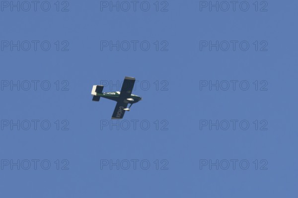 Van's RV-9 light aircraft flying in a blue sky, England, United Kingdom