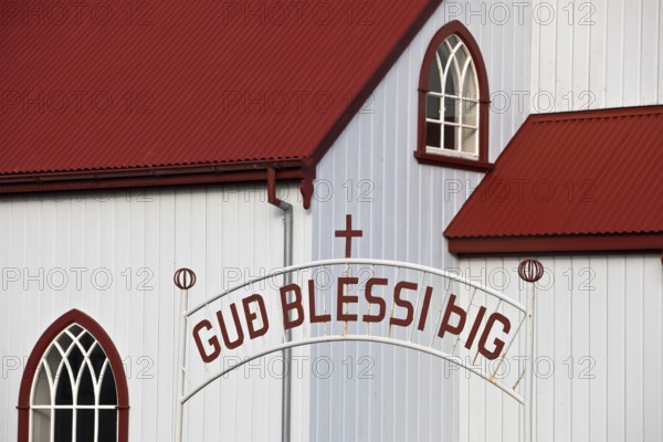 Church in Vopnafjördur with lettering on the entrance gate, East Iceland, Iceland