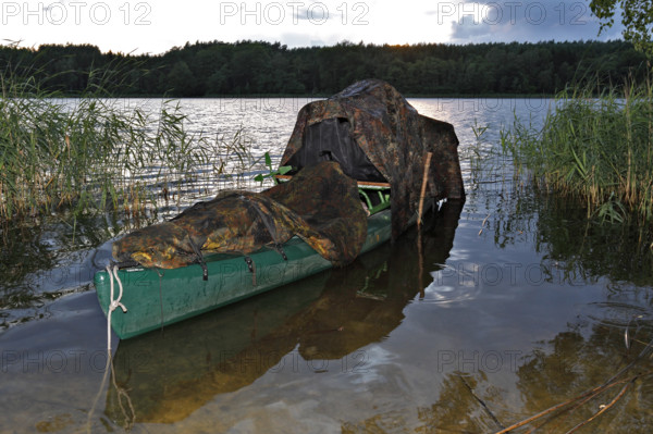 Kayak of a nature photographer in the water, Müritz National Park, Mecklenburg-Western Pomerania, Germany