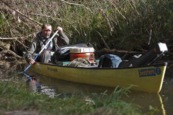 Canoeists in a canoe, Müritz National Park, Mecklenburg-Western Pomerania, Germany