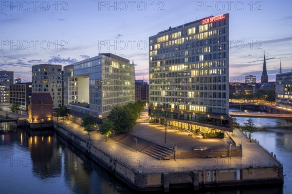 Aerial view of the Spiegel building at Ericusspitze in Hamburg's HafenCity in the Brooktorkai neighbourhood at blue hour, Hamburg, GermanyDefault