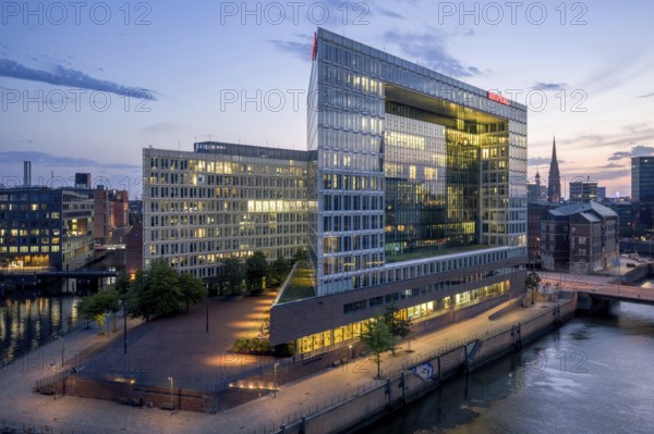 Aerial view of the Spiegel building at Ericusspitze in Hamburg's HafenCity in the Brooktorkai neighbourhood at blue hour, Hamburg, Germany