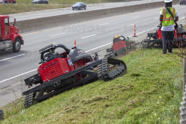 Harper Woods, Michigan - Remote-control mowers are cutting the grass and weeds along Interstate 94 and other freeways running through Detroit. The machines are said to be safer when operating on the steep embankments along most of the city's freeways