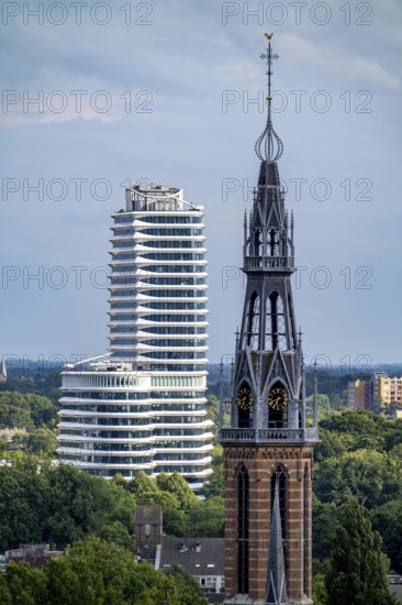 St Joseph's Cathedral Sint Martinusparochie Groningen in the foreground, behind it the tax office building of Groningen, Belastingkantoor, with 2300 workplaces and 25 floors, also here is the Dutch Student Loans Office, Netherlands