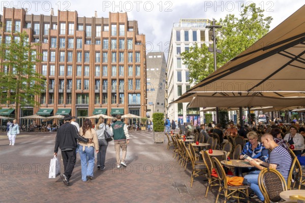 The Grote Markt in the old town of Groningen, modern facades of hotel and commercial buildings, in the centre the Forum Groningen, gastronomy, Netherlands